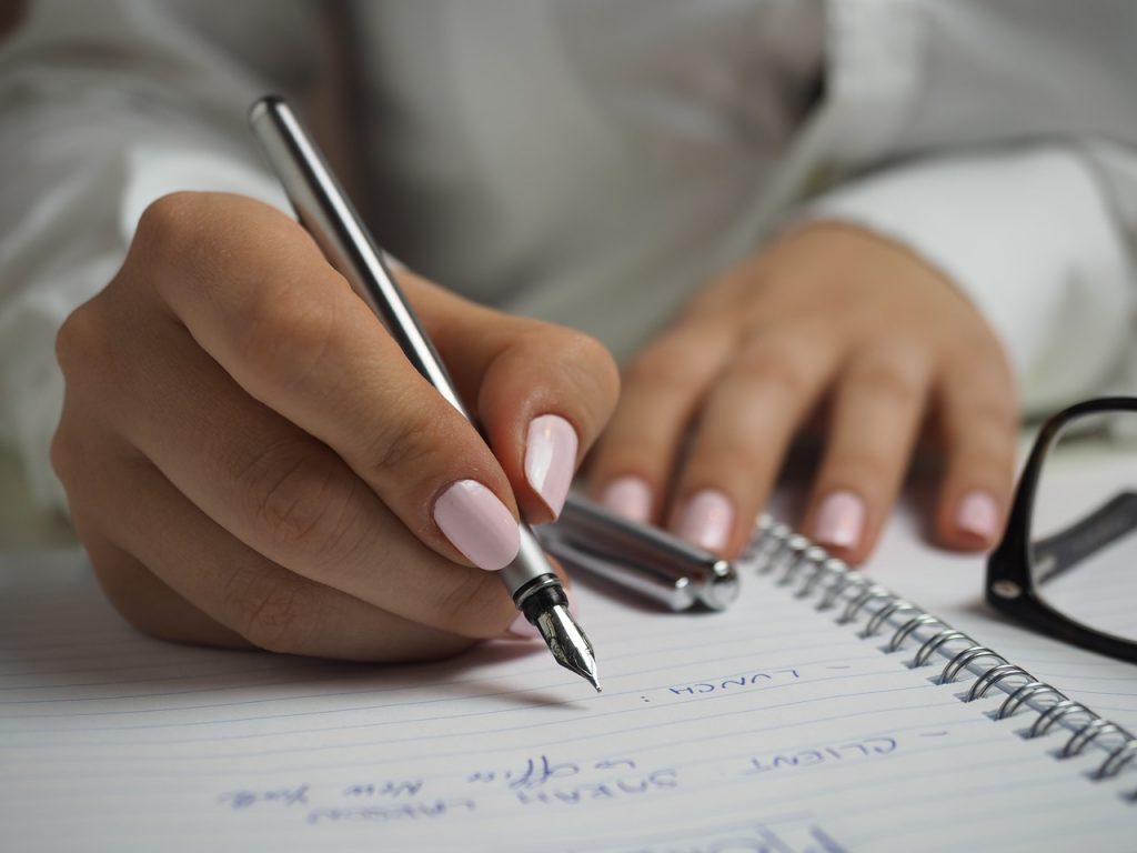 woman-hands-writing-in-notebook-1024x768
